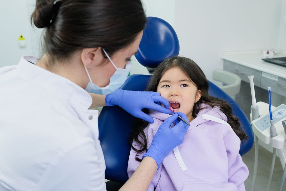 Dental sealants for kids Kharghar, dentist checking a child's molars at Reform Dental Clinic Sector 15