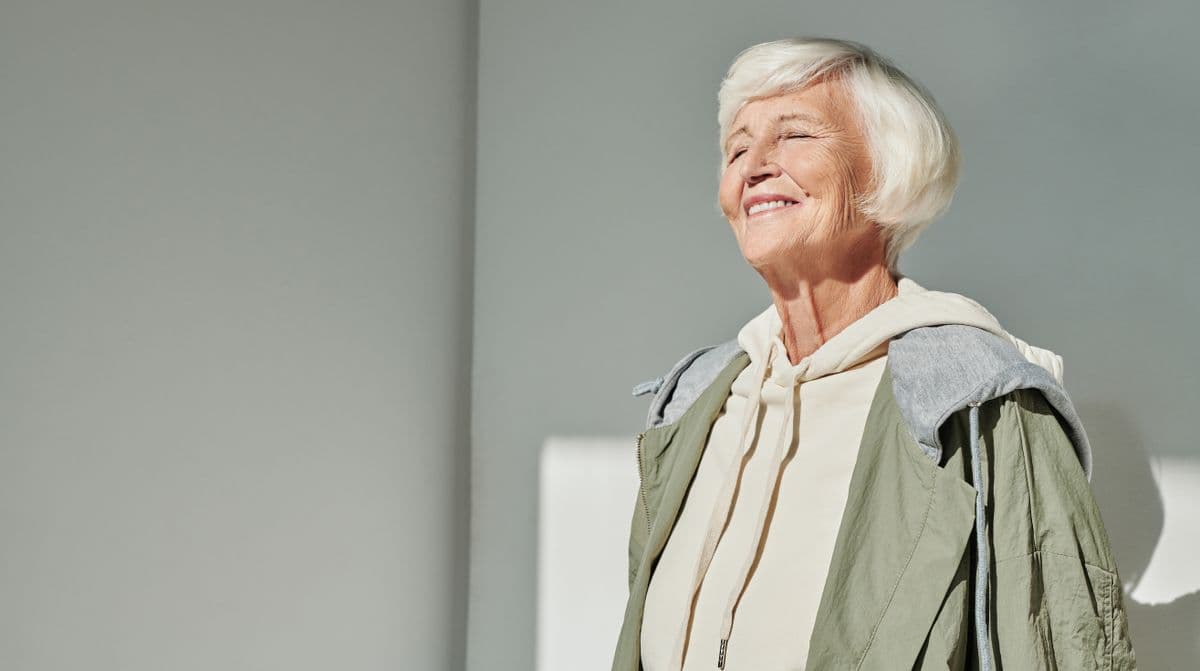 full mouth dental implants Kharghar, senior woman smiling after All-on-4 at Reform Dental Clinic Sector 15