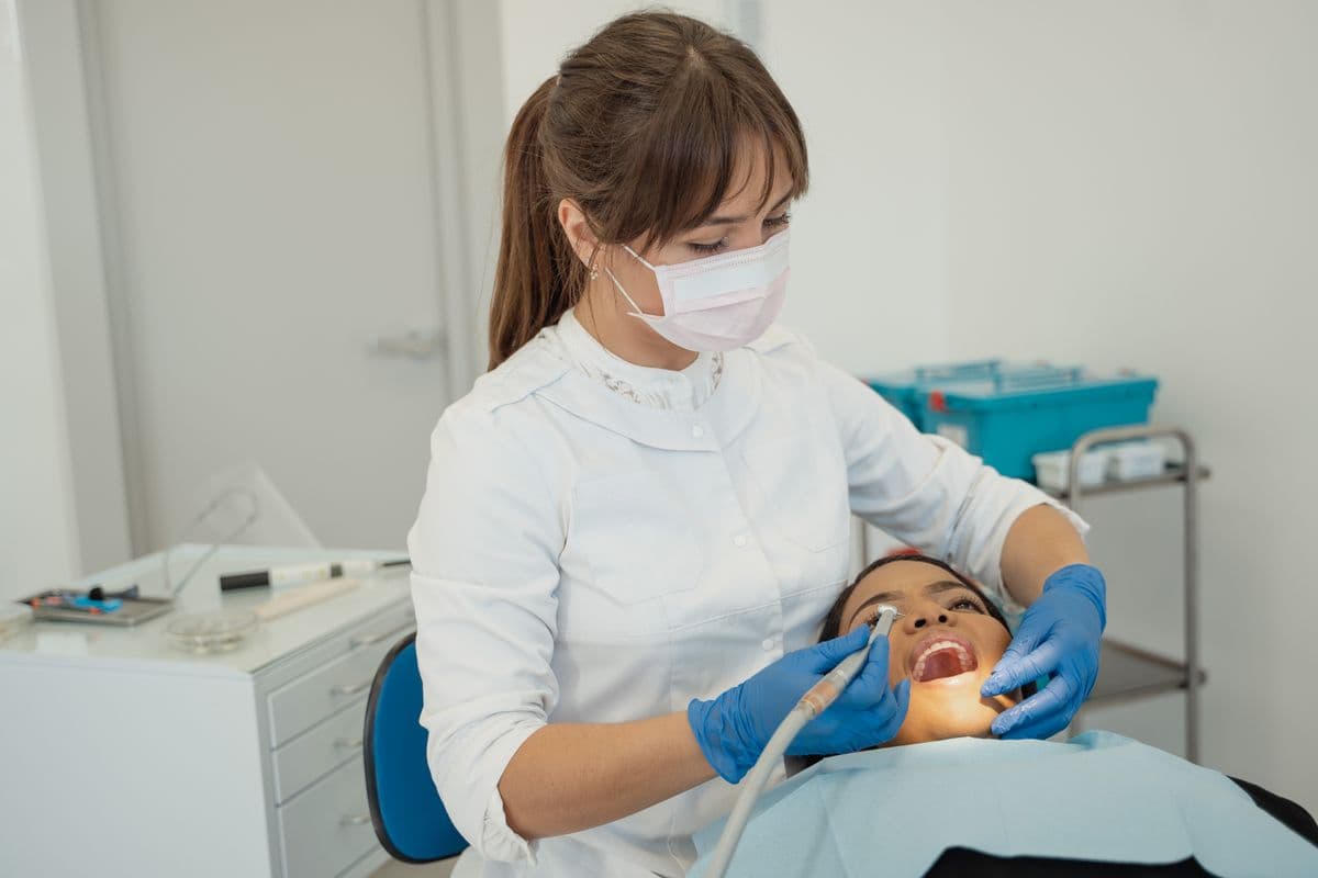 teeth cleaning Kharghar dentist giving a patient a routine scaling and check-up at Reform Dental Clinic Sector 15