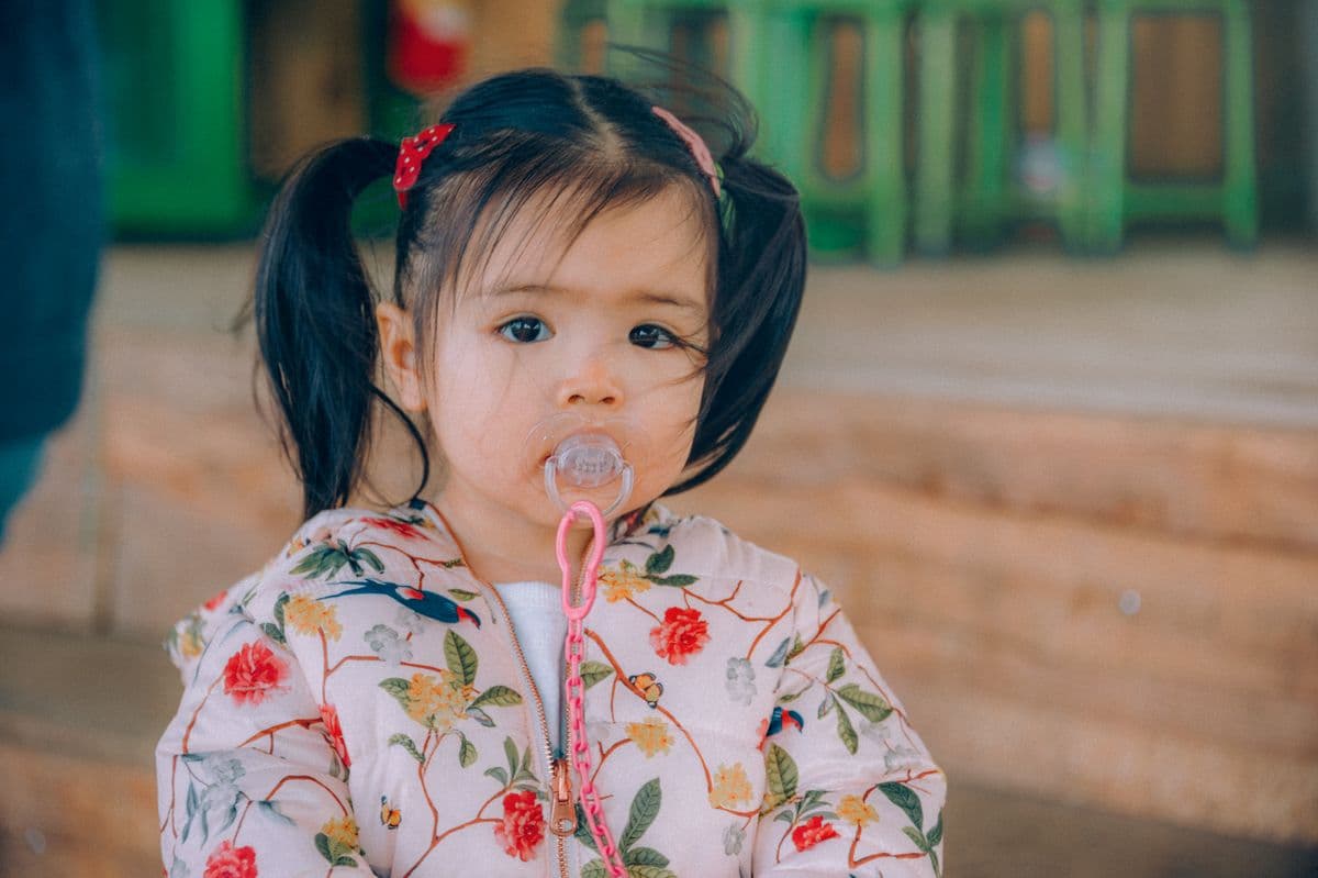 Thumb sucking in kids Kharghar, toddler with a pacifier, Reform Dental Clinic