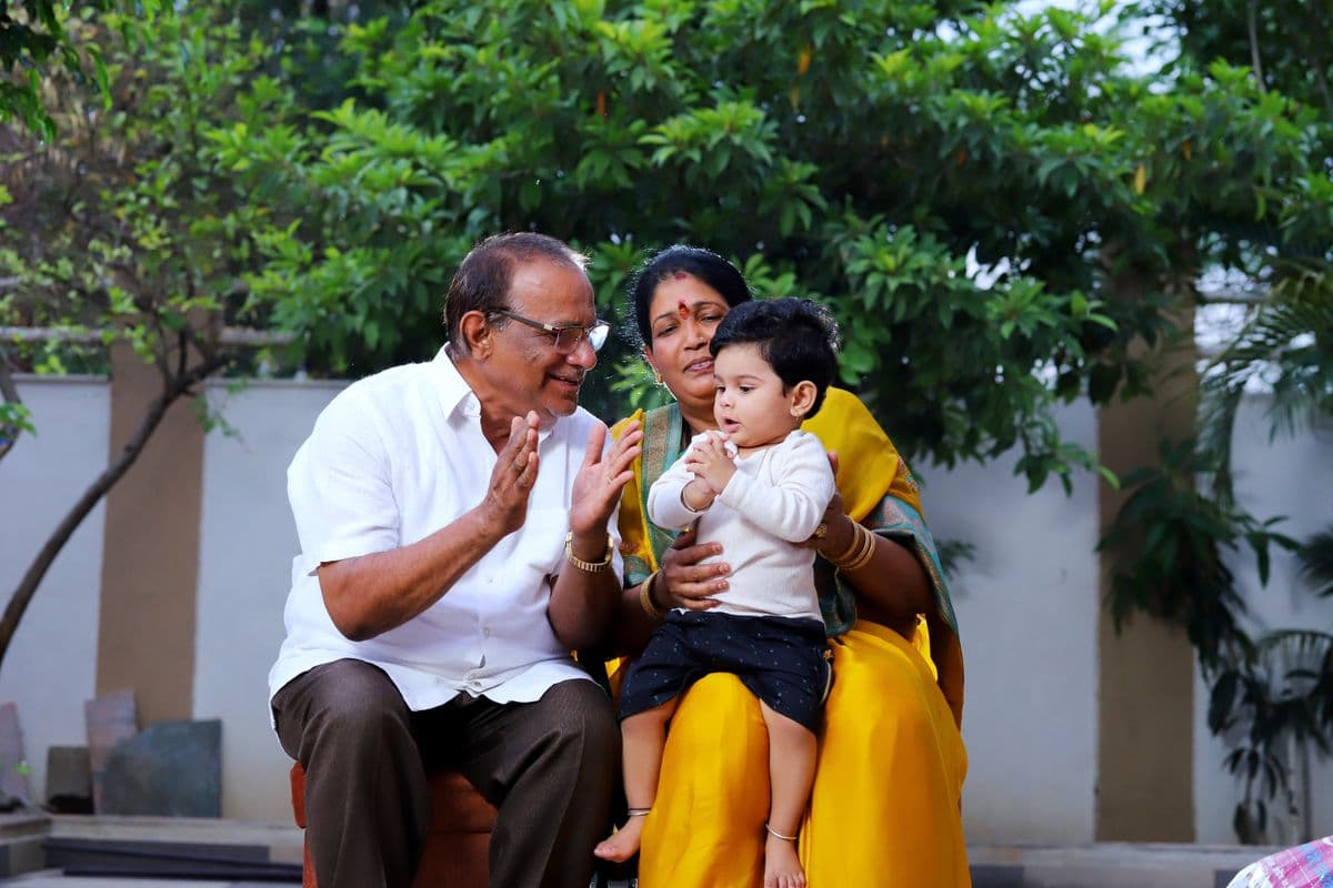 Full mouth rehabilitation Kharghar, smiling Indian grandparents with their grandchild, Reform Dental Clinic Sector 15