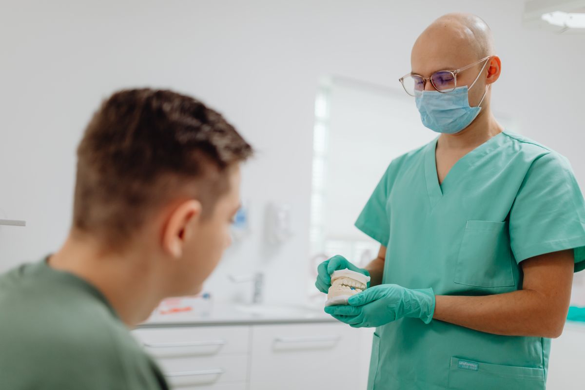 dental implant procedure Kharghar dentist consulting patient at clinic